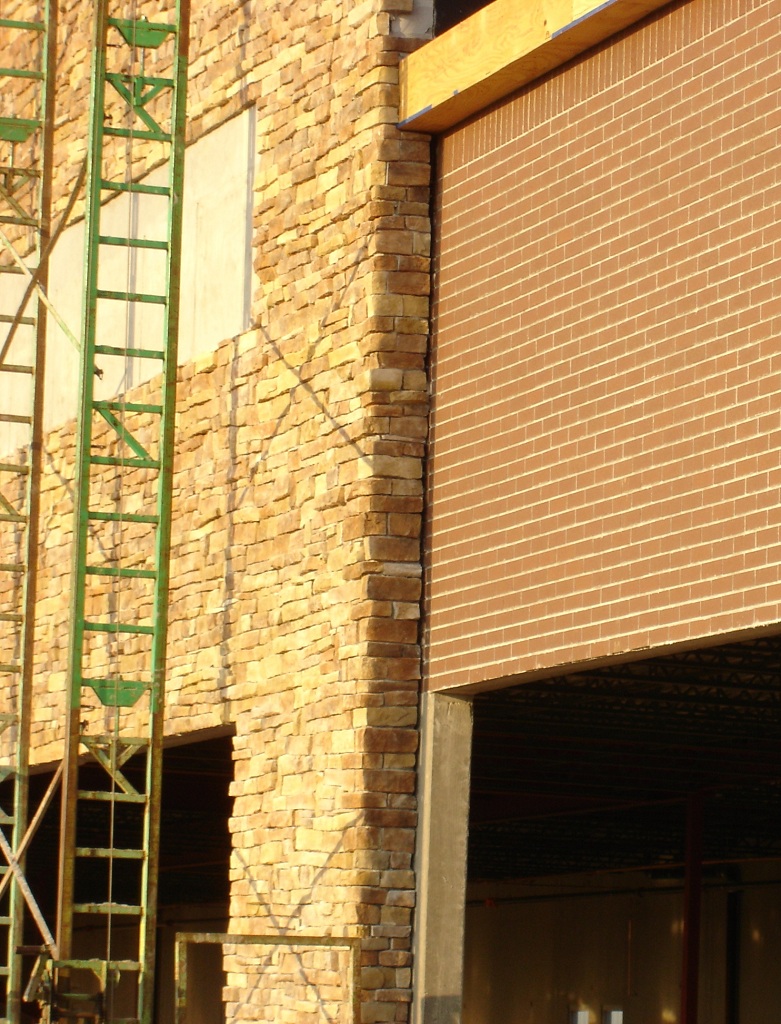 manufactured stone and clay brick construction