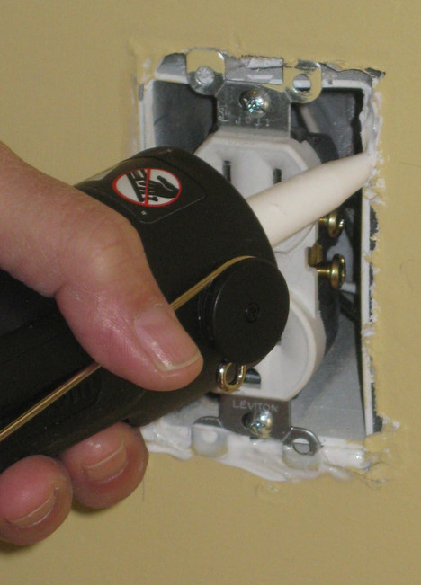 Caulking around a wall switch | Photo courtesy of Joe Provey Caulking around a wall switch